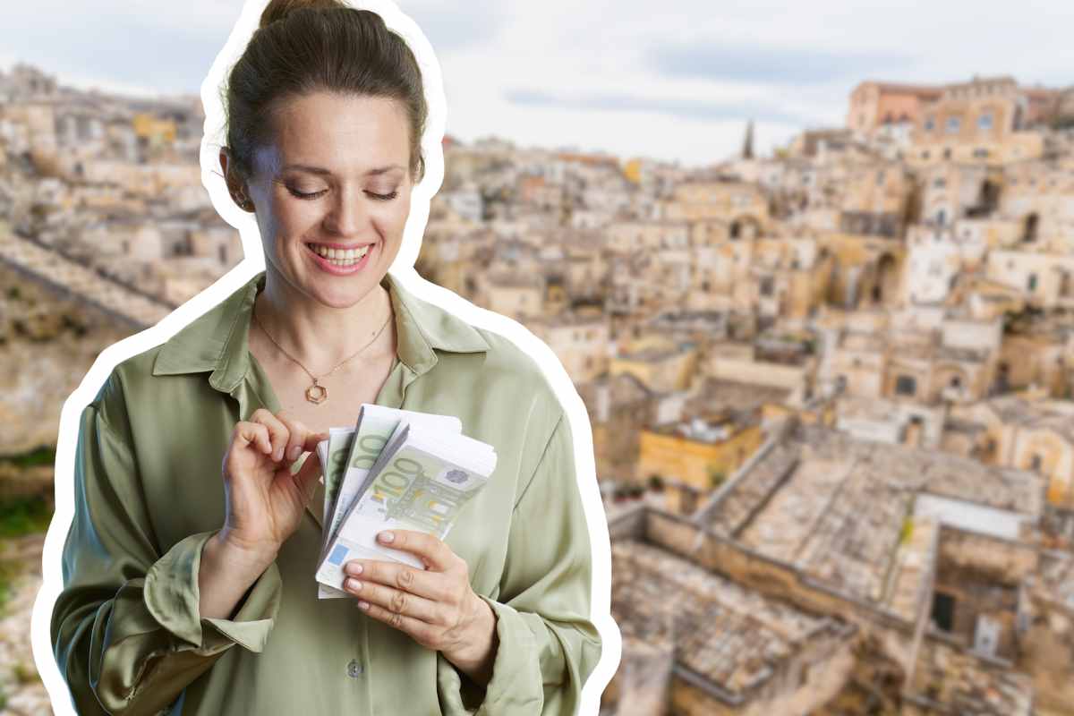 donna euro in mano sfondo città